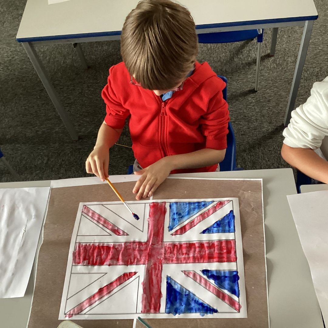 A pupil painting the union flag for VE day