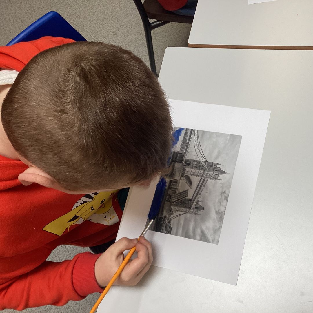 A pupil creating artwork of tower bridge for VE day