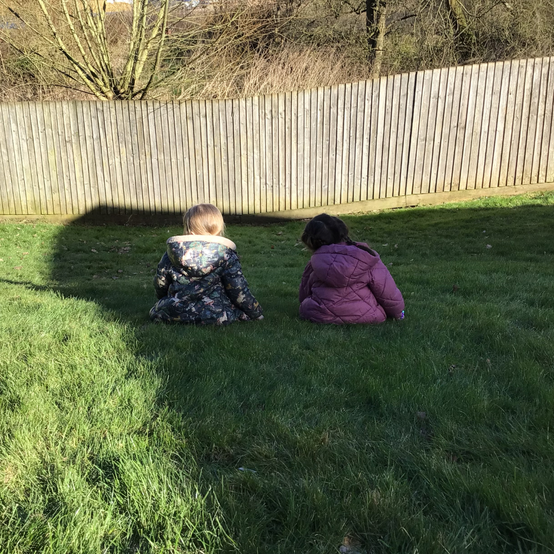 two children in the nursery garden